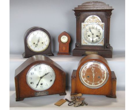 Four various vintage and antique mantel clocks to include an oak cased twin train mantel clock, a Bakelite example and two ot