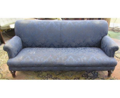 A late 19th century sofa, with scrolled arms on fluted supports