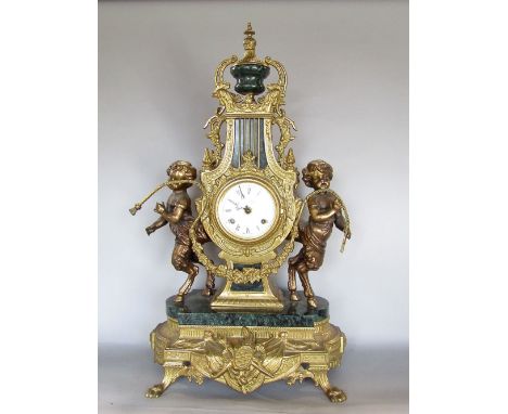 French style gilt cast metal lyre mantel clock, the convex enamelled two train movement inscribed imperial, with Roman numera