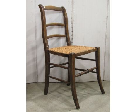 Set of eleven light weight Regency style stained beechwood dining/occasional chars, with swept slender triple bar backs, over