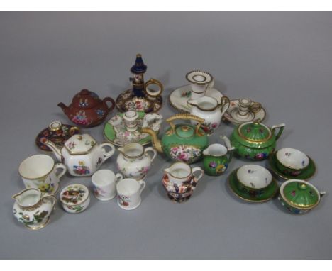 A collection of mainly early 19th century and later decorative miniature ceramics including five chamber sticks with various 