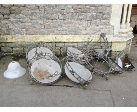 A suite of four large contemporary light metal framed hanging ceiling lights/plafonnier, with loose mottled glass shades, hun