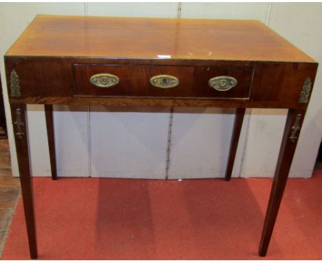 A 19th century mahogany writing table, raised on four tapered supports, with applied cast brass mounts, the frieze drawer wit