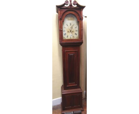 A mahogany longcase clock with panelled framework, enclosing an arched and painted dial, with subsidiary calendar and seconda
