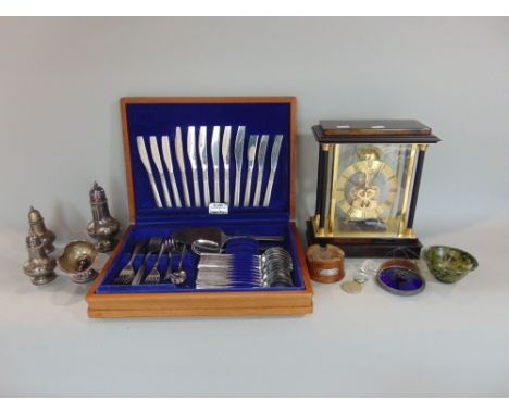 A mixed lot to include a part canteen of cutlery, spinach green jade bowl, a mantel clock, with open escapement, odd coinage,