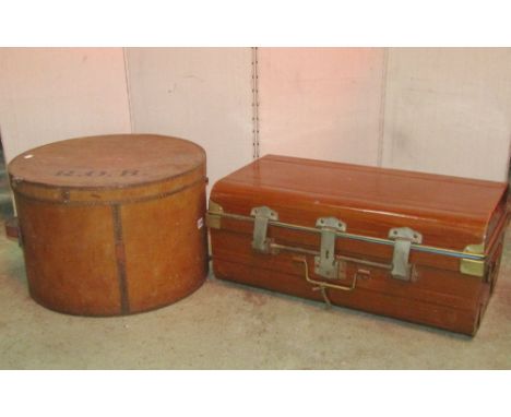 A vintage plywood hat box of squat cylindrical form, with leather strap handle and painted initials to lid ROB, together with