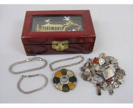 Silver charm bracelet hung with an interesting selection of novelty / articulated charms to include Clifton Suspension Bridge