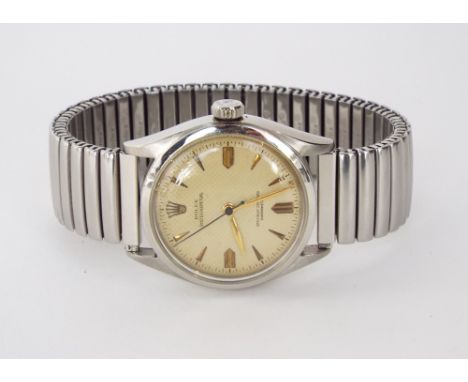 Good 1950s Rolex oyster perpetual chronometer stainless steel wristwatch, the honeycomb dial with rose gold baton markers, or