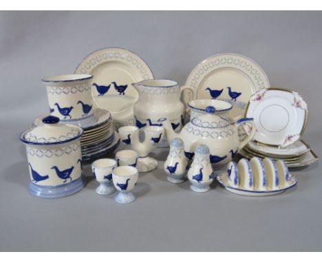 A collection of Chelsea Works Moorland kitchen wares with blue stencil type decoration of geese comprising a jug, a lidded st