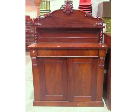 A Victorian mahogany chiffonier the raised arched and moulded back with acanthus detail and narrow shelf raised on spiral twi