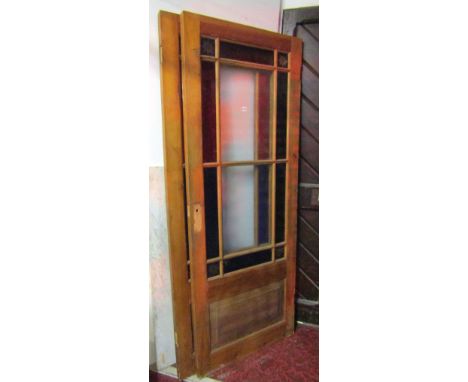 A pair of reclaimed pine internal doors, partially glazed with stained glass and starburst panels, together with a pair of si