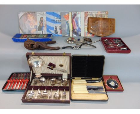 A box of interesting items to include Black Forest nut cracker, collection of singles to include Do They Know It's Christmas,