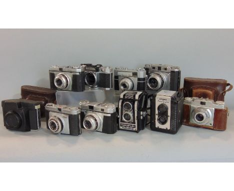 A dozen vintage cameras, a mix of 35 mm and 120 film, German and Japanese, some in original cases