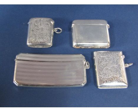 Two similar early 20th century vesta cases engraved with scrolled acanthus together with a further vesta case and a hip shape