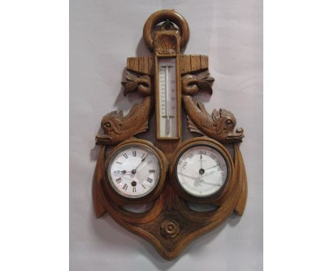 Good early 20th century carved oak clock barometer/thermometer in the form of an anchor flanked by coiled fish, 48cm high