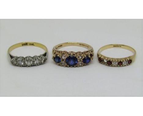 Three gold rings comprising an 18ct white stone set ring, a 9ct Victorian style blue spinel example and a further 9ct paste s
