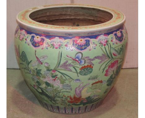 A Chinese fish bowl light green ground decorated with mandarin, duck, flower, bird and further repeating decorative detail, s