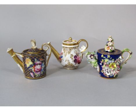 A collection of three good quality early 19th century miniature watering cans comprising a blue ground Derby example with enc