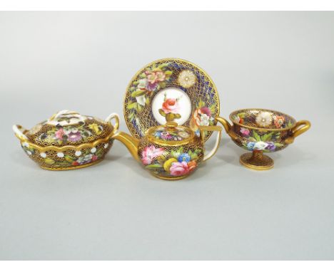 A collection of early 19th century Spode miniature wares in pattern number 1166 with well painted floral sprays on a blue and