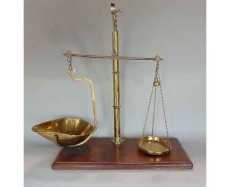 Pair of 19th century brass scales, upon a mahogany plinth base, 67cm high