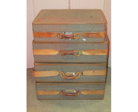 Four Hartmann good quality suitcases (two sizes) with combination locks, tweed clad and light stitched tan leather bound