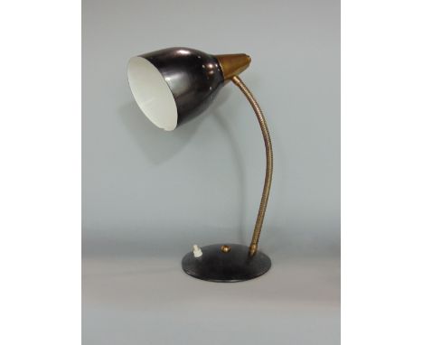 A vintage table lamp with coiled brass bendy stem pierced shade and domed platform base