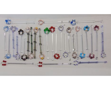 Collection of 29 vintage lace bobbins, all in glass by Tufnell, with spangles (displayed in cabinet)