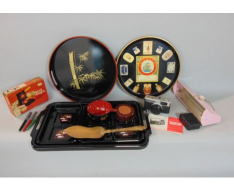 Mixed miscellaneous lot to include a vintage Olympus camera, breweryana tray, Japanese lacquered ware and a collection of Chr