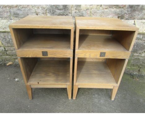 A pair of contemporary lime washed, light oak bedside lamp tables of square cut form, with open shelves, tapered legs and cen