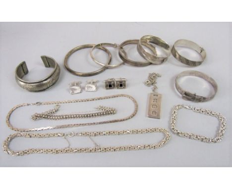 Mixed lot of silver / white metal jewellery to include an ingot pendant necklace, a hinged bangle of buckle design with engra
