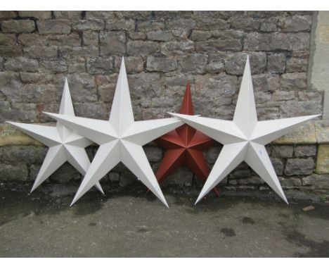 A pair of painted light steel star shaped wall plaque, 104cm, together with two further smaller matching examples (3)