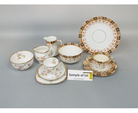 A collection of Royal Albert Crown china tea wares with Art Deco type floral decoration comprising milk jug, sugar bowl, cake