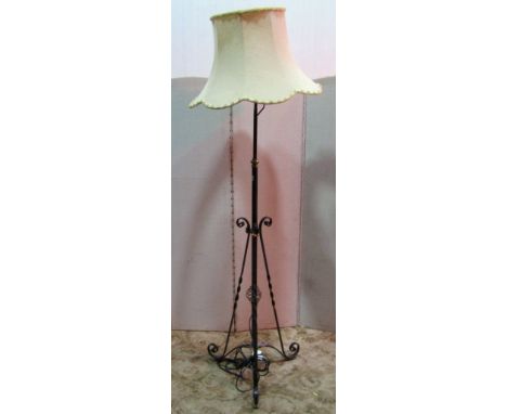 An iron work floor standing telescopic oil lamp standard, with simple scroll, copper flower head detail, (later converted to 