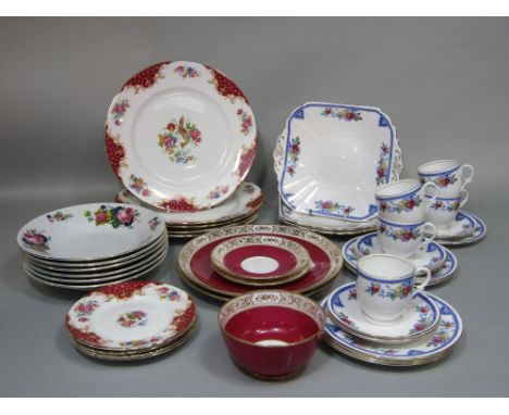 A collection of Shelley tea wares with fruit border decoration comprising three cake serving plates, five cups, five saucers 