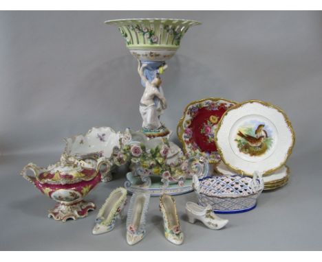 A collection of decorative ceramics including a large continental table centre piece with applied classical figures, painted 