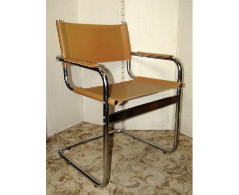 A pair of Marcel Brewer style cantilever chairs with light tan leather strap work seat, back and arm pads, tubular steel fram