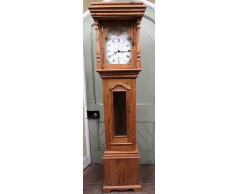 A pine longcase clock in the Georgian style, the hood with turned column supports including a broken arch dial and electronic