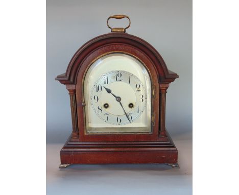 Early 20th century mahogany cased twin train mantle clock, the arched case with silvered dial, chapter ring with Arabic numer