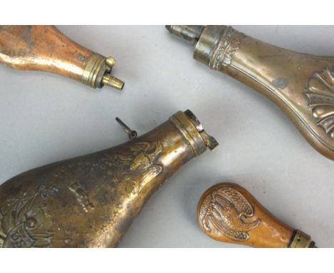 A group of powder flasks to include an American military 1837 pattern flask, 20cm long, a smaller copper powder flask with an