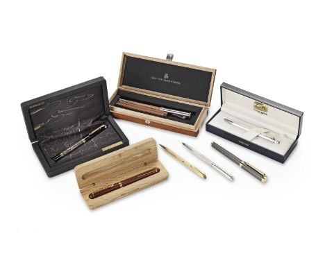 A selection of cased pensTo include: a limited edition Pelikan fountain pen with 18ct. nib and engraved body; a Caran d'Ache 