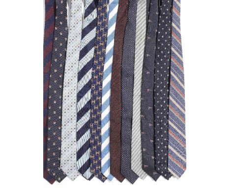 A selection of twelve silk ties belonging to Sir Roger MooreOf mainly blue tones, to include: a silk Yacht Club tie; a stripe