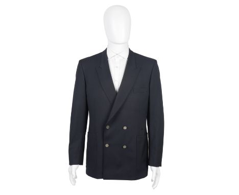 An Yves Saint Laurent Blue BlazerThe jacket with peaked lapels, four silver buttons each embossed 'YSL', large pockets and fo