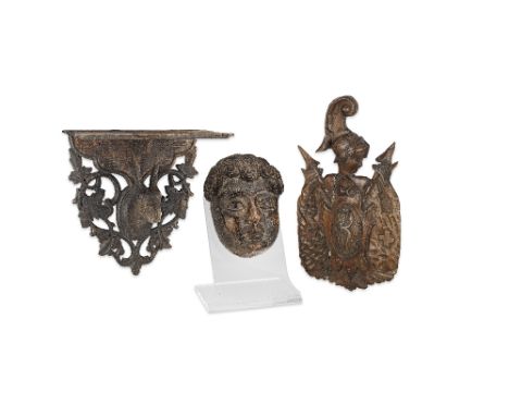 A Swiss carved fruitwood armorialWith central monogram initialled ILR, together with a Black Forest carved linden wood hangin