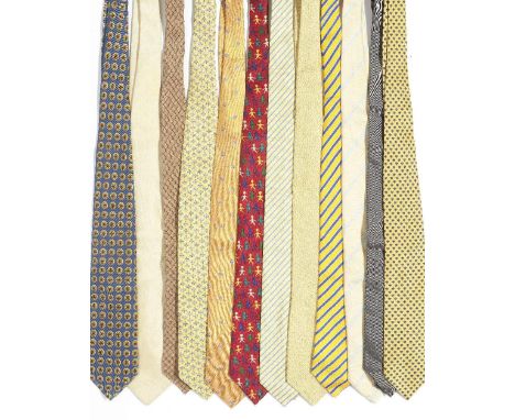 A selection of twelve silk ties belonging to Sir Roger MooreOf mainly yellow tones, to include: a yellow and blue stripe tie 