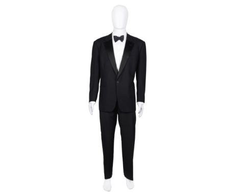 A bespoke Italian dinner suit for Sir Roger MooreUnlabelled in black wool with silk lapels and single button fastening, toget