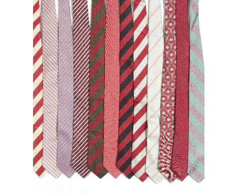 A selection of twelve silk ties belonging to Sir Roger MooreOf mainly pink, purple and red tones, to include: a silk tie made
