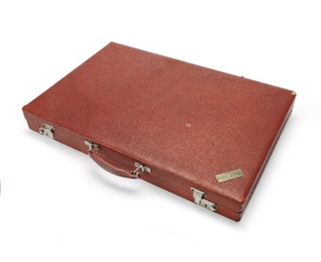 A large red simulated leather backgammon case belonging to Sir Roger MooreUsed during breaks on set of the filming of James B