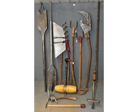 The Borrowers (1997) Nine prop oversized weapons from the film, including bottle opener, corkscrew, and drill bit and a cross