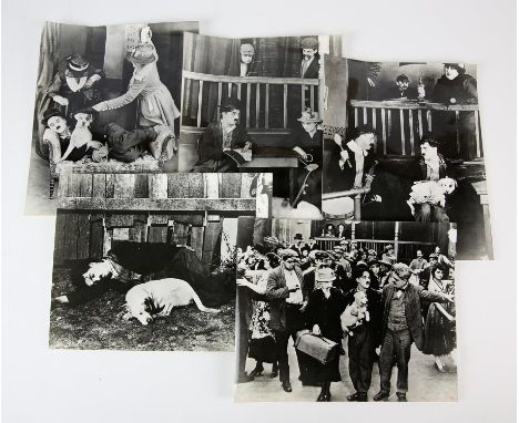 Charlie Chaplin - Five vintage black and white film stills from The Chaplin Revie, 10 x 8 inches (5). 