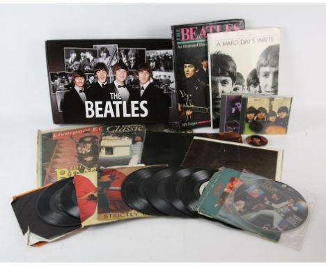 The Beatles, Elvis Presley, and music related  a group of books, vinyl single records, and ephemera, includes, two books, TUR